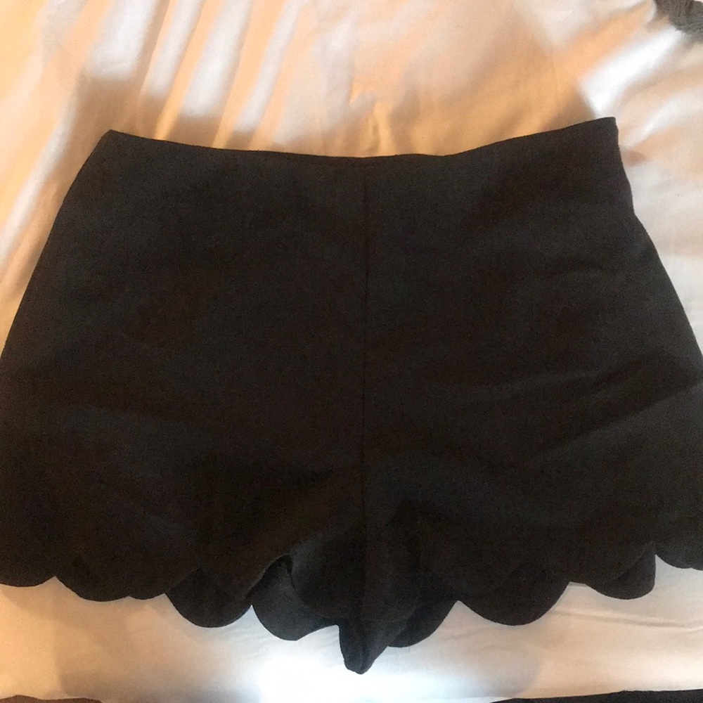 Scalloped bottom black shorts